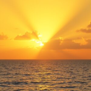 A peaceful sunrise over calm ocean waters with golden light streaming through clouds, symbolizing divine presence and hope.