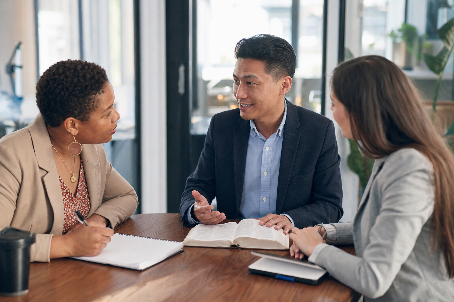 Christian professional sharing testimony with two coworkers
