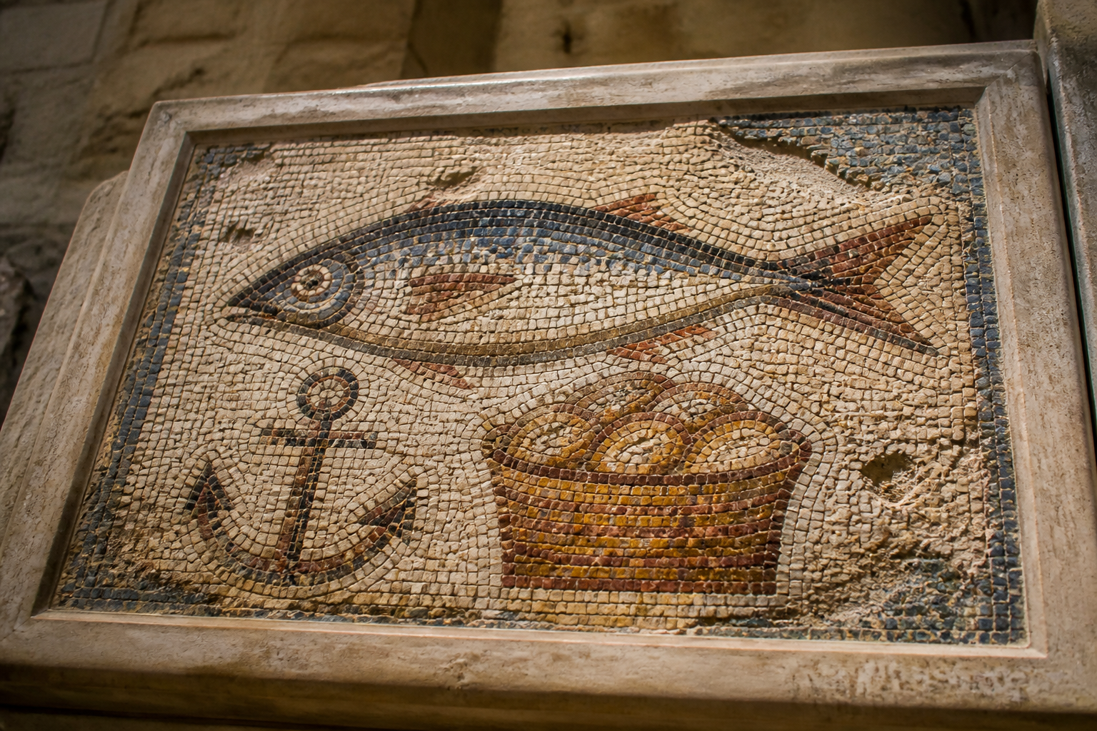 Early Christian fish mosaic with an anchor and bread basket