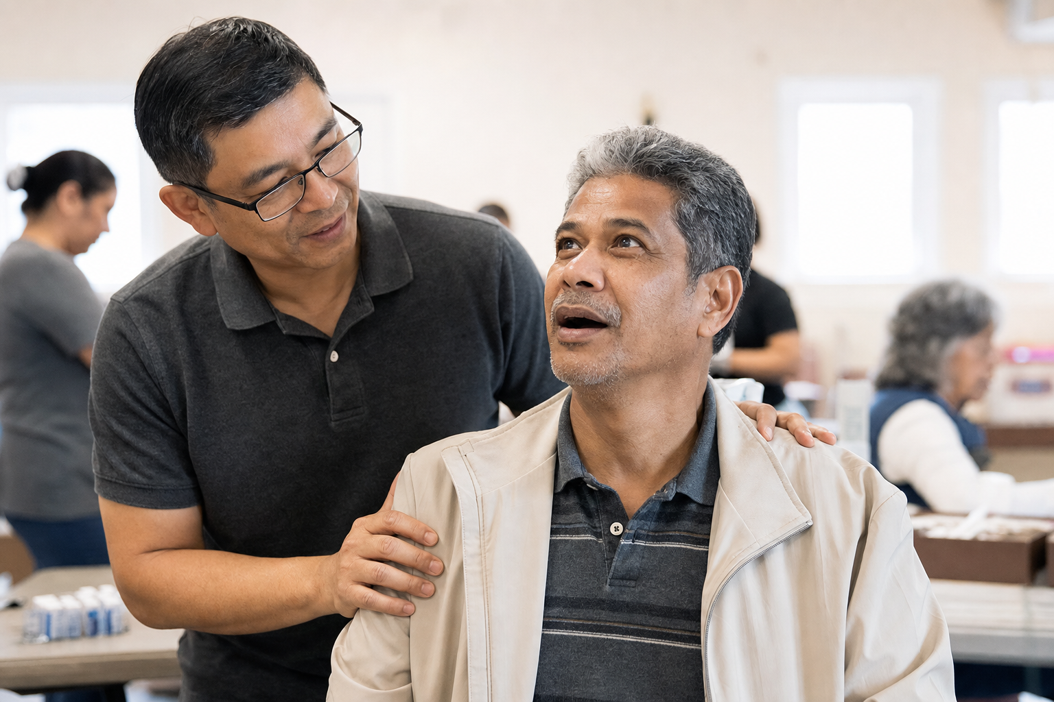 Man supporting another man discovering sight for the first time